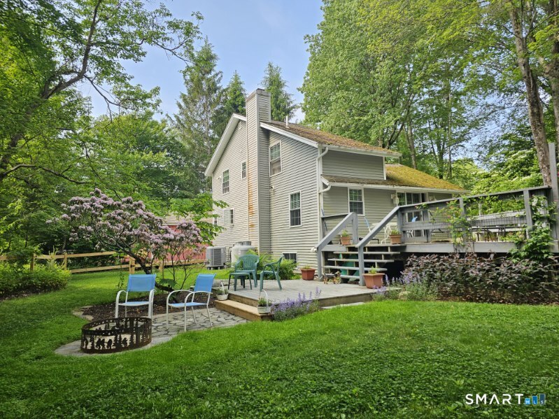 28 Davis Road New Hartford, CT 06057 - Photo 38 of 39 a view of a chair and table in backyard of the house