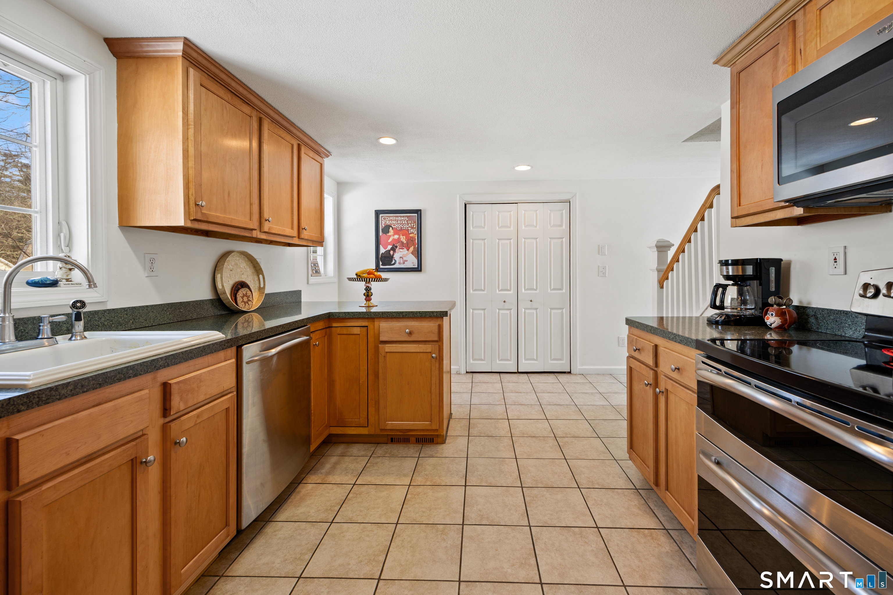 28 Davis Road New Hartford, CT 06057 - Photo 5 of 39 a kitchen with stainless steel appliances a sink stove and cabinets