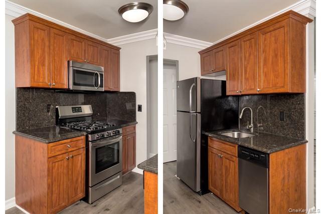 111 College Road, Unit 8G Selden, NY 11784 - Photo 2 of 7 a kitchen with stainless steel appliances granite countertop a stove top oven microwave and refrigerator