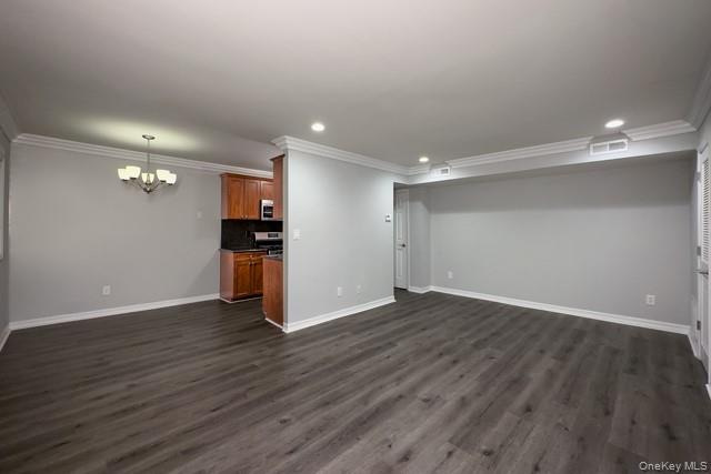 111 College Road, Unit 8G Selden, NY 11784 - Photo 3 of 7 a view of an empty room with wooden floor kitchen view and a window
