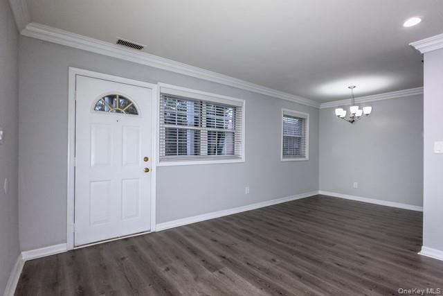 111 College Road, Unit 8G Selden, NY 11784 - Photo 4 of 7 a view of an empty room with wooden floor and a window
