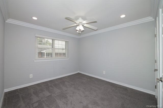 111 College Road, Unit 8G Selden, NY 11784 - Photo 5 of 7 an empty room with a window and a fan