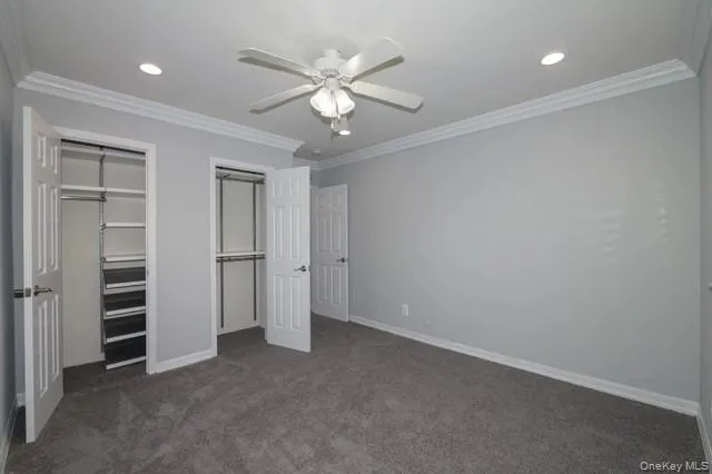 an empty room with closet and entryway
