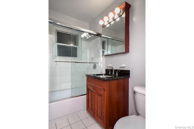 111 College Road, Unit 8G Selden, NY 11784 - Photo 7 of 7 a bathroom with a sink a toilet and mirror