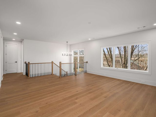 a bathroom with a sink vanity mirror and toilet