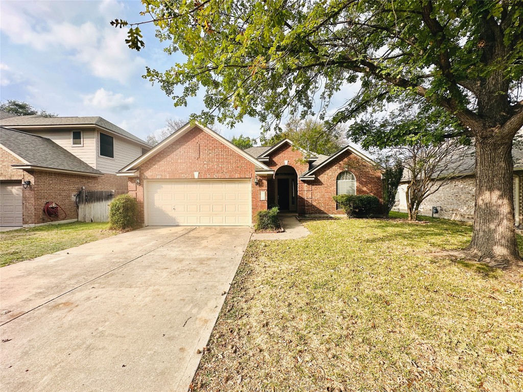1101 Hunter's Creek Drive Cedar Park, TX 78613 - Photo 1 of 37 a front view of a house with a yard and garage