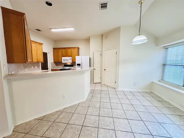 a view of a bathroom from a hallway