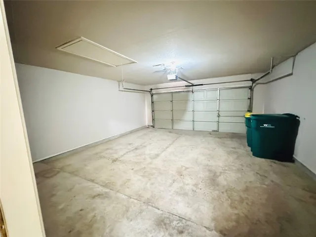 a kitchen with a stove a sink dishwasher and a refrigerator