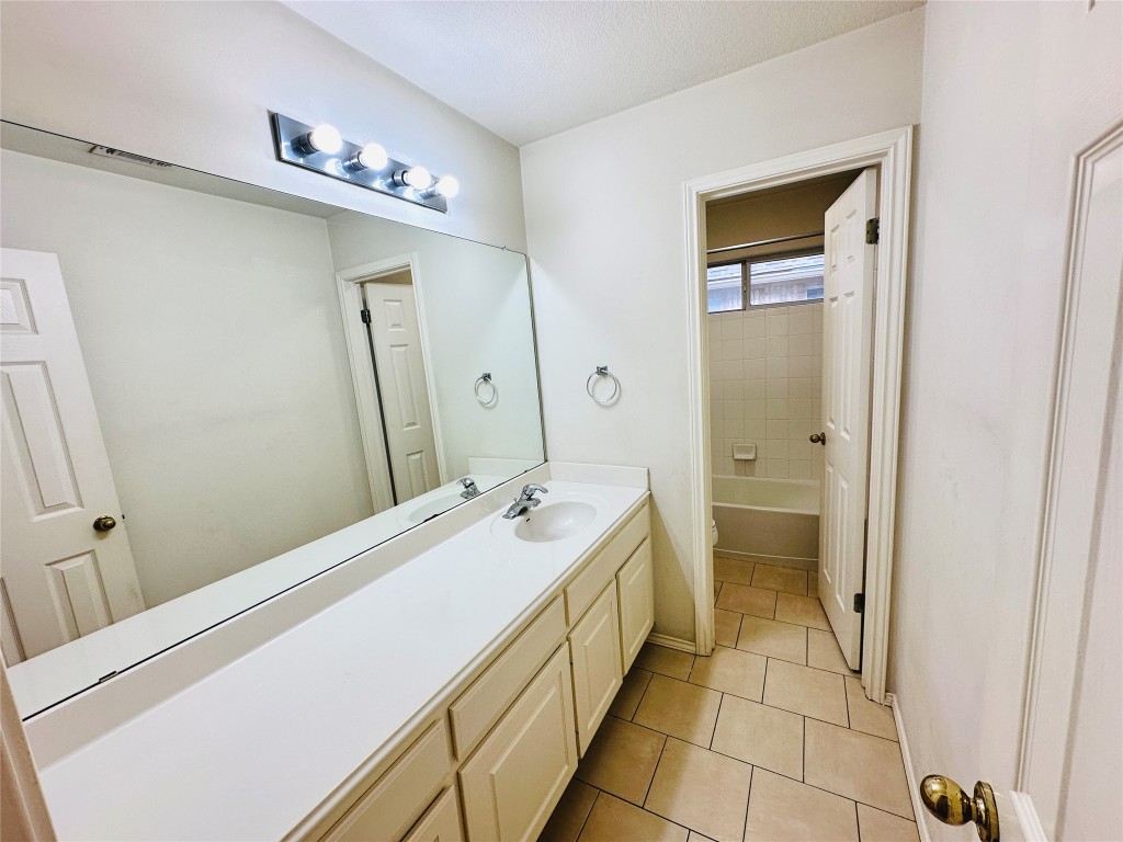 1101 Hunter's Creek Drive Cedar Park, TX 78613 - Photo 21 of 37 a bathroom with a sink a toilet and shower
