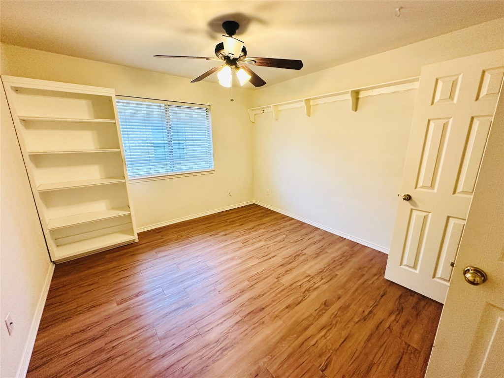 1101 Hunter's Creek Drive Cedar Park, TX 78613 - Photo 24 of 37 a view of empty room with wooden floor and fan