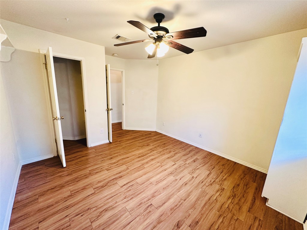 1101 Hunter's Creek Drive Cedar Park, TX 78613 - Photo 25 of 37 a view of an empty room with wooden floor