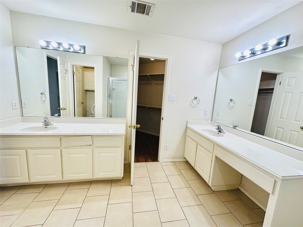 1101 Hunter's Creek Drive Cedar Park, TX 78613 - Photo 30 of 37 a bathroom with a sink vanity and a mirror
