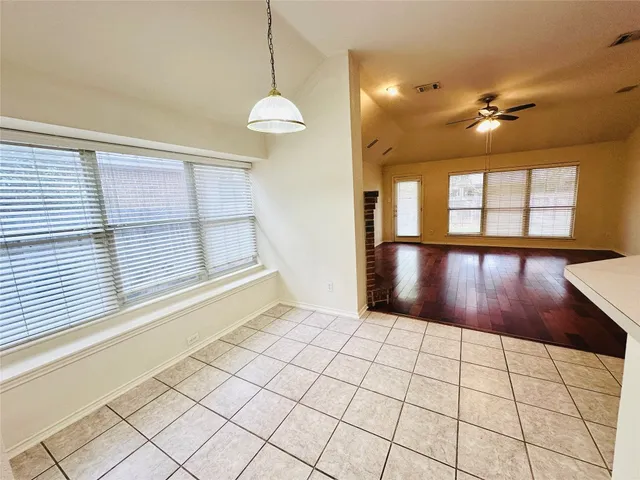 a view of livingroom with hardwood floor and a ceiling fan