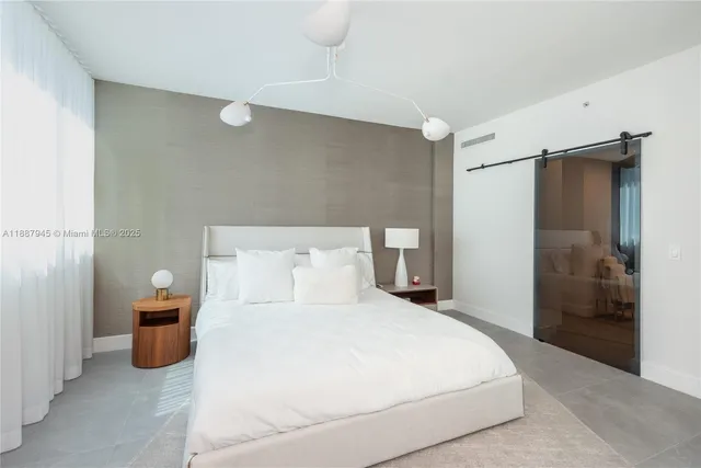 a bedroom with a bed and a walk in closet