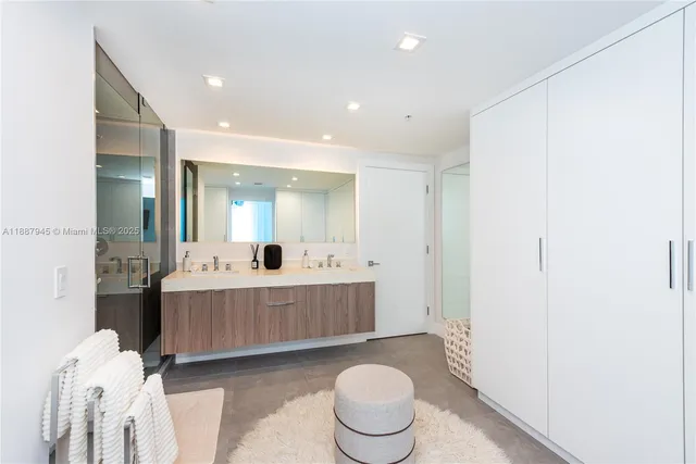 a living room with furniture and a mirror