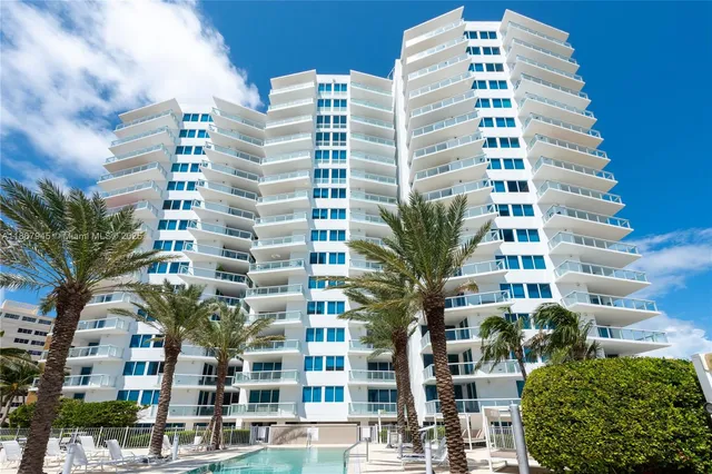 a swimming pool with outdoor seating and yard
