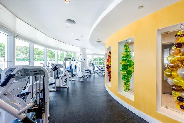 a large room with a large window and furniture