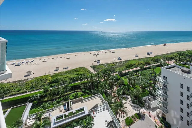 an aerial view of beach and ocean