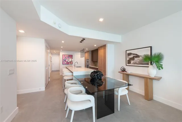 a dining room with furniture and a painting