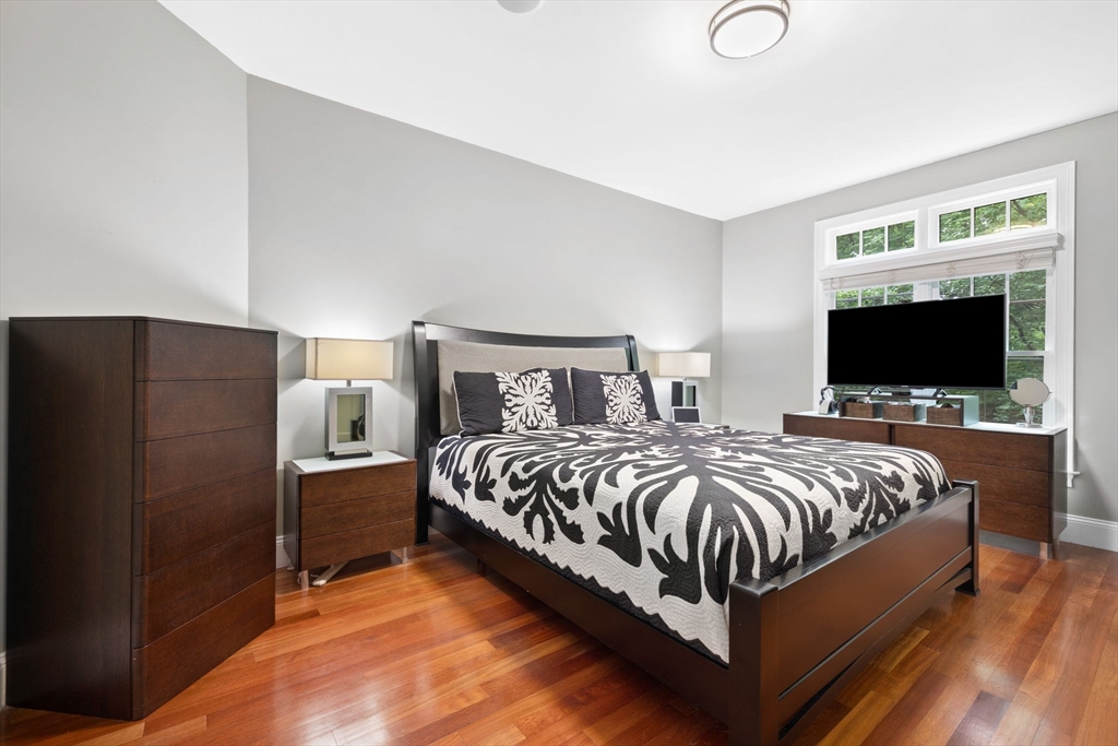 20 Hamlet Street, Unit 1 Newton, MA 02459 - Photo 15 of 41 a bedroom with bed and flat screen tv