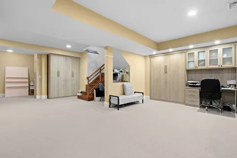 a backyard of a house with plants and trees