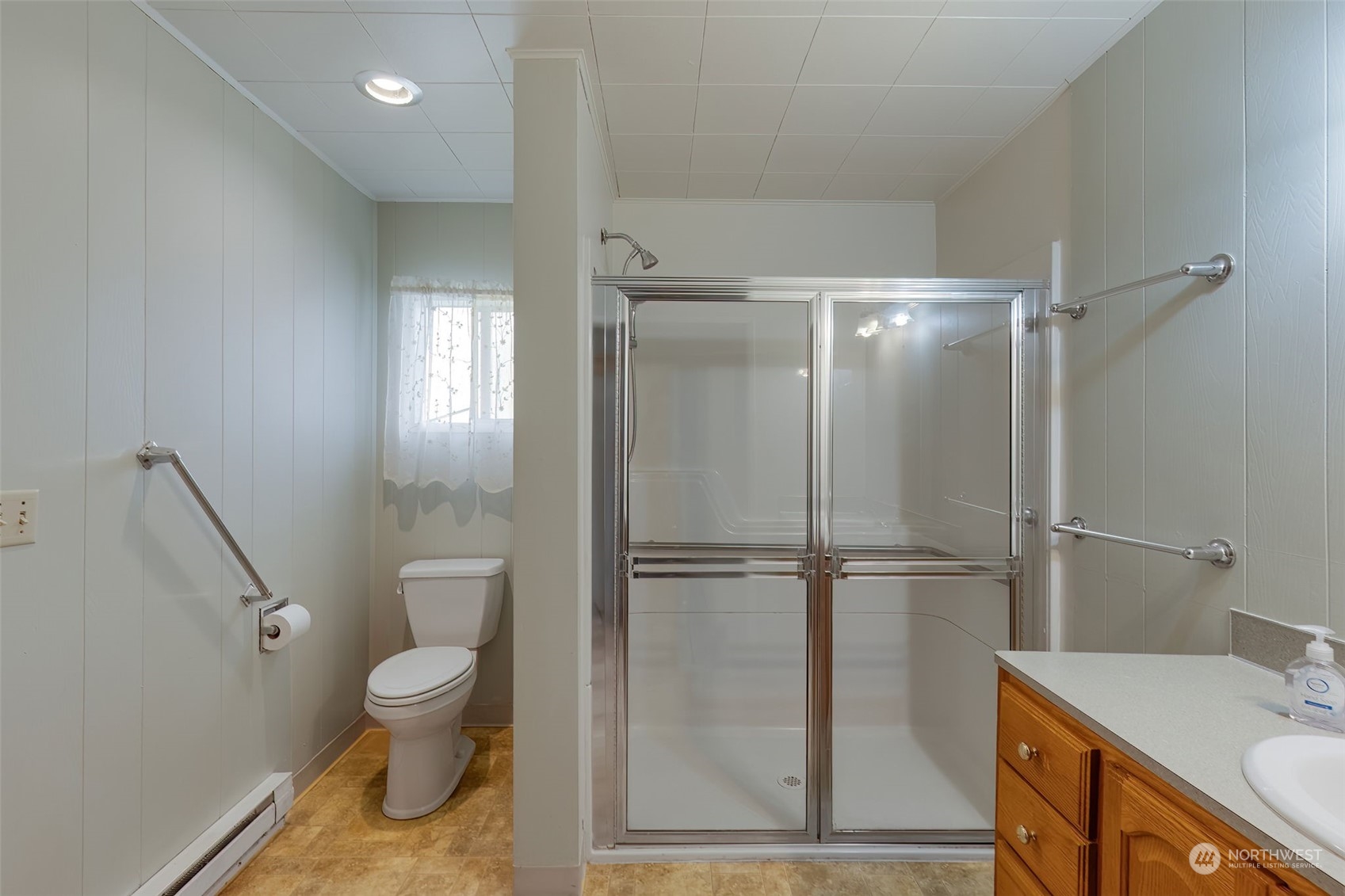 805 8th Avenue Longview, WA 98632 - Photo 12 of 32 a bathroom with a granite countertop sink toilet and shower
