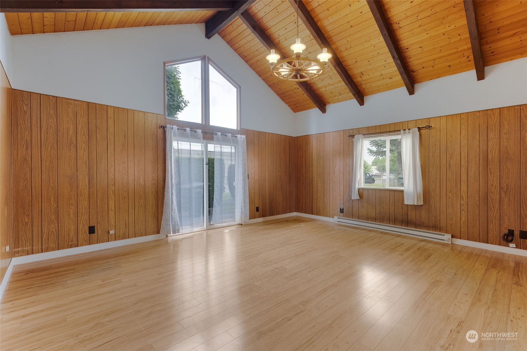 805 8th Avenue Longview, WA 98632 - Photo 2 of 32 an empty room with wooden floor and windows
