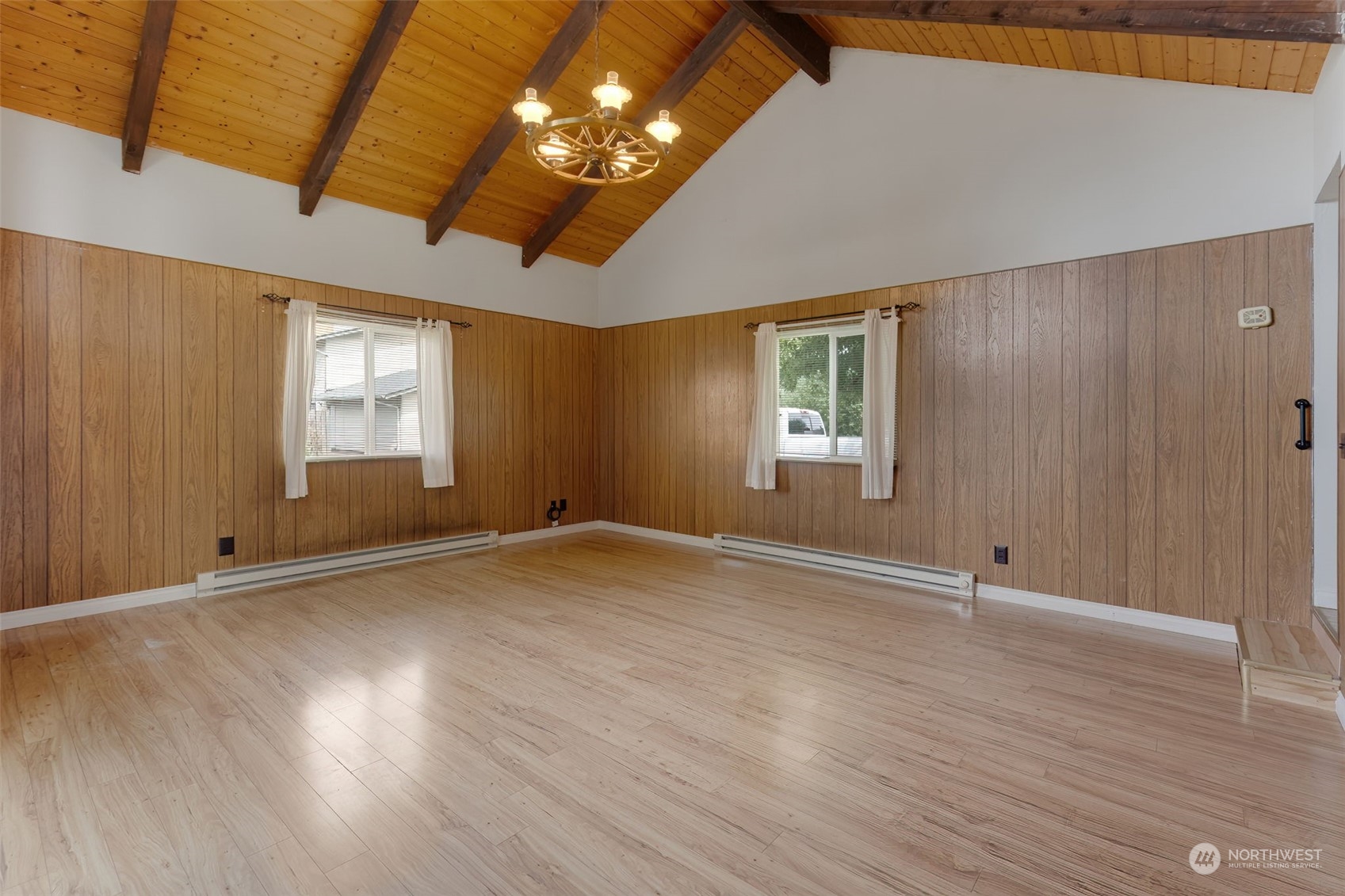 805 8th Avenue Longview, WA 98632 - Photo 24 of 32 an empty room with wooden floor and windows