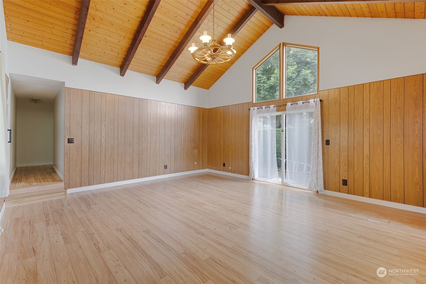 805 8th Avenue Longview, WA 98632 - Photo 25 of 32 a view of an empty room with wooden floor and a window