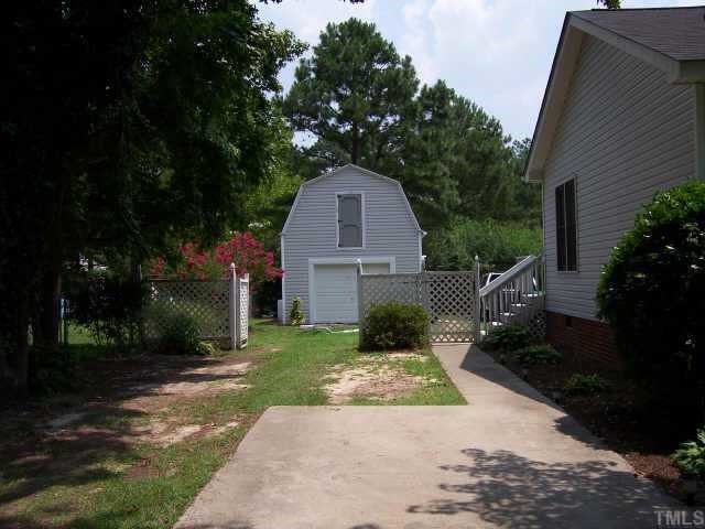 110 Old Farm Road Smithfield, NC 27577 - Photo 2 of 10 Side View of house with detached garage. Great Landscaping