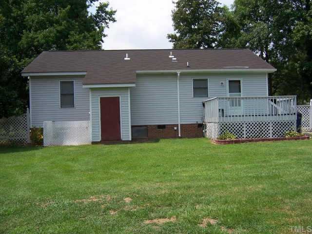 110 Old Farm Road Smithfield, NC 27577 - Photo 3 of 10 View of back of home with deck and attached storage area