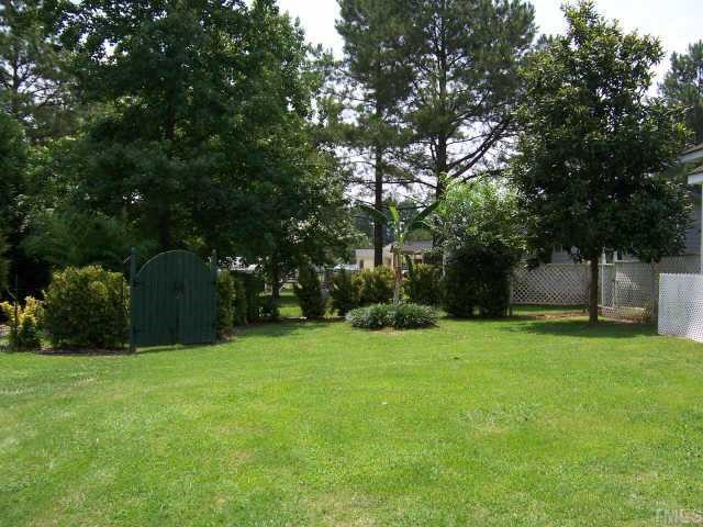 110 Old Farm Road Smithfield, NC 27577 - Photo 4 of 10 Great view of beautiful landscaped backyard