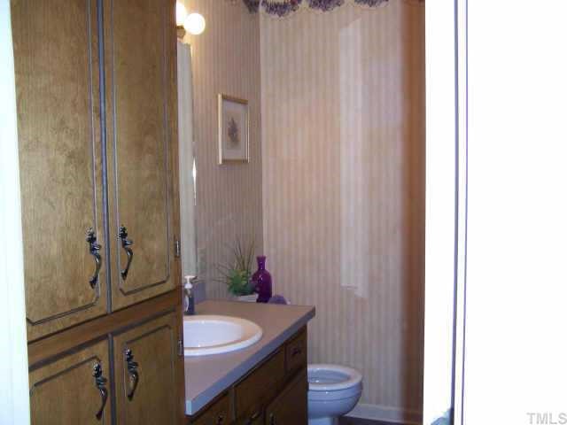 110 Old Farm Road Smithfield, NC 27577 - Photo 9 of 10 Nice size 2nd bath in hallway. Nice storage cabinets for all your bathroom needs.