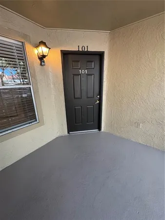 a view of a hallway with a door