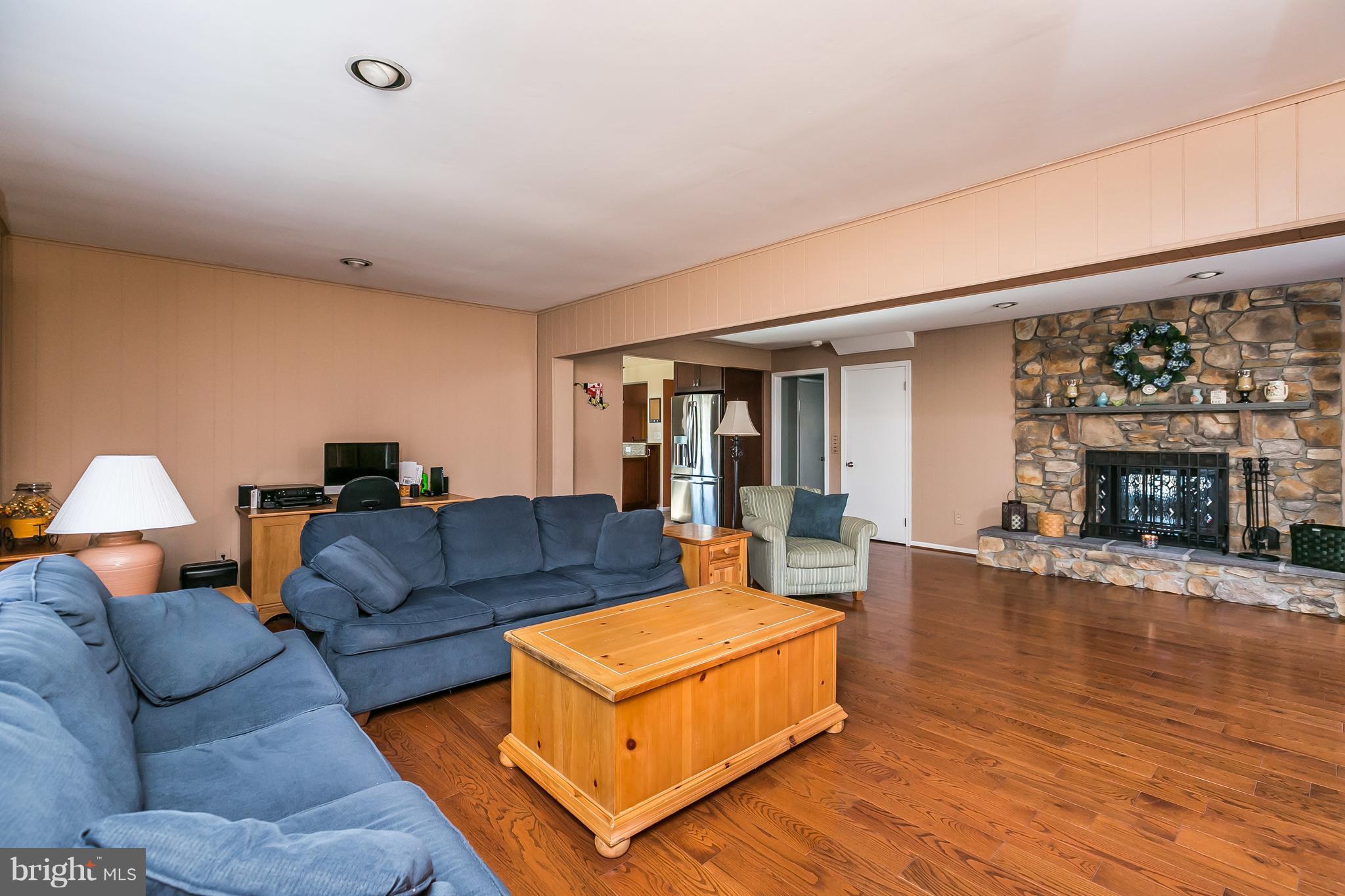 213 Rickswood Road Lutherville-Timonium, MD 21093 - Photo 12 of 28 Family room with Wood burning dual sided fireplace