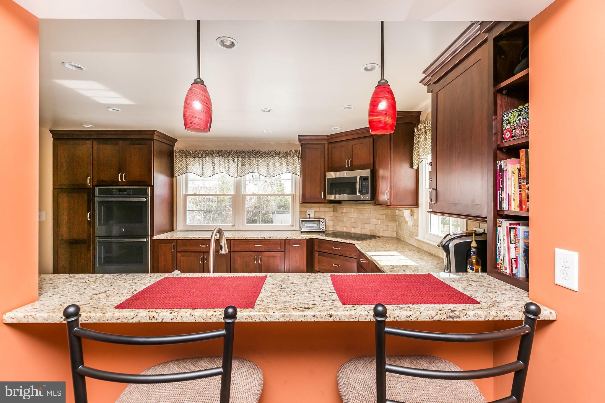 213 Rickswood Road Lutherville-Timonium, MD 21093 - Photo 8 of 28 Custom kitchen with breakfast bar