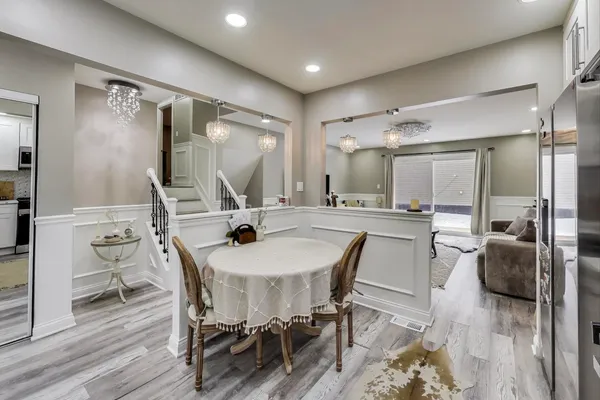 a view of a dining room kitchen and a wooden floor