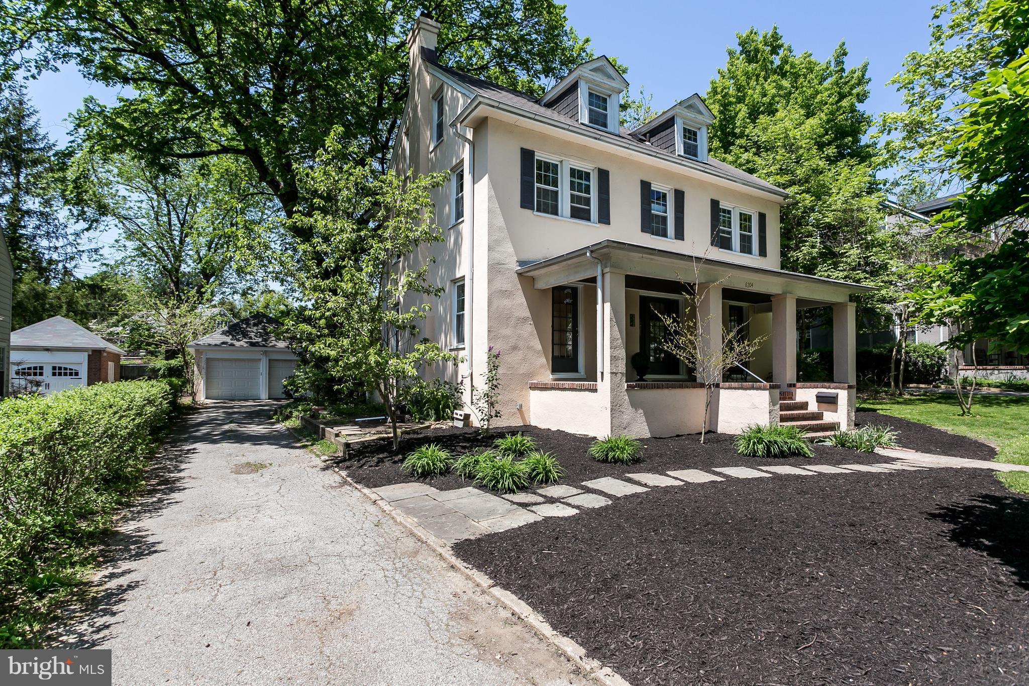 6204 Pinehurst Road Baltimore, MD 21212 - Photo 2 of 29 a front view of a house with a yard table and chairs