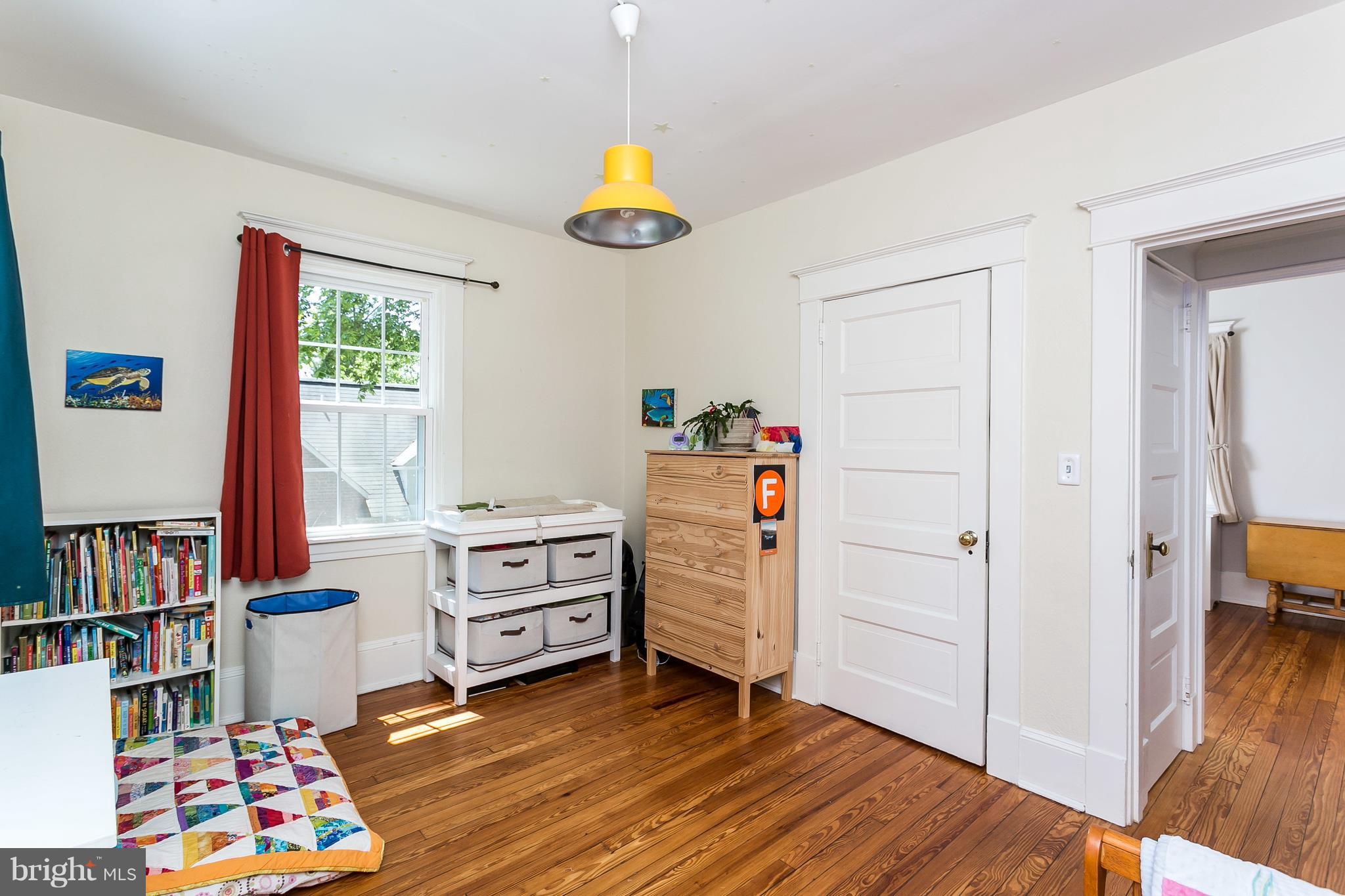 6204 Pinehurst Road Baltimore, MD 21212 - Photo 19 of 29 a view of room with toys and wooden floor