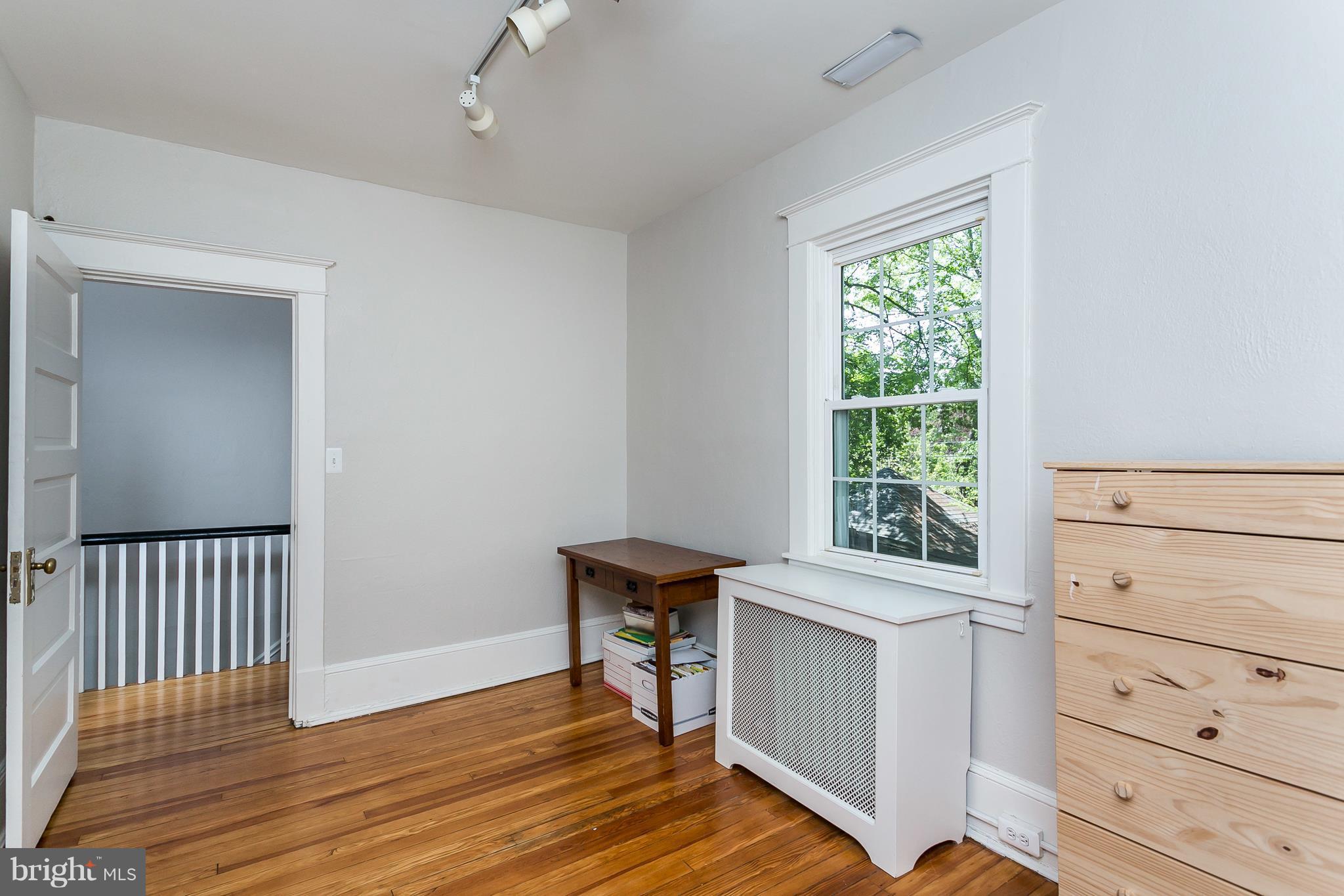 6204 Pinehurst Road Baltimore, MD 21212 - Photo 21 of 29 a view of a room with baby crib and a window