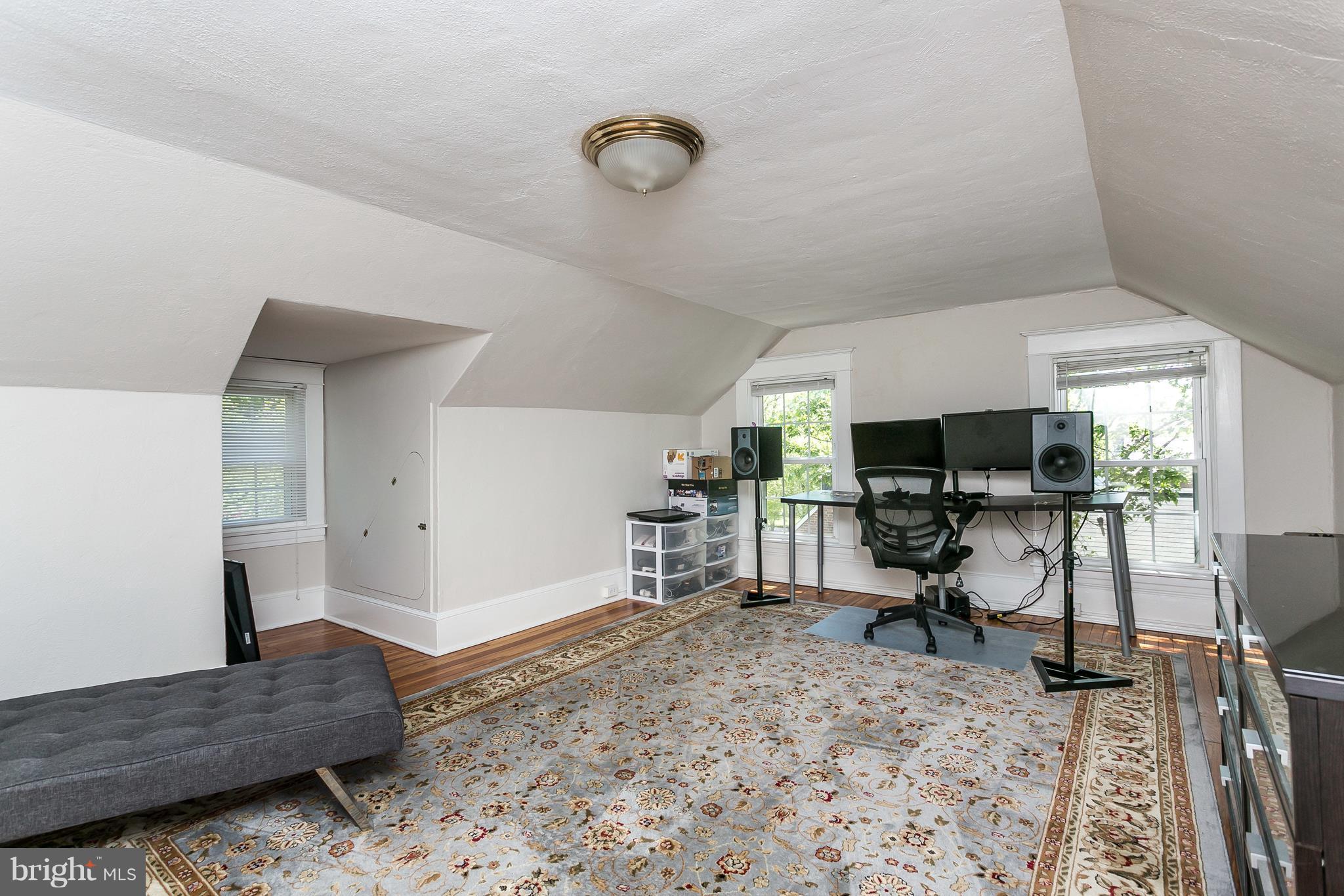 6204 Pinehurst Road Baltimore, MD 21212 - Photo 22 of 29 a living room with furniture and a flat screen tv
