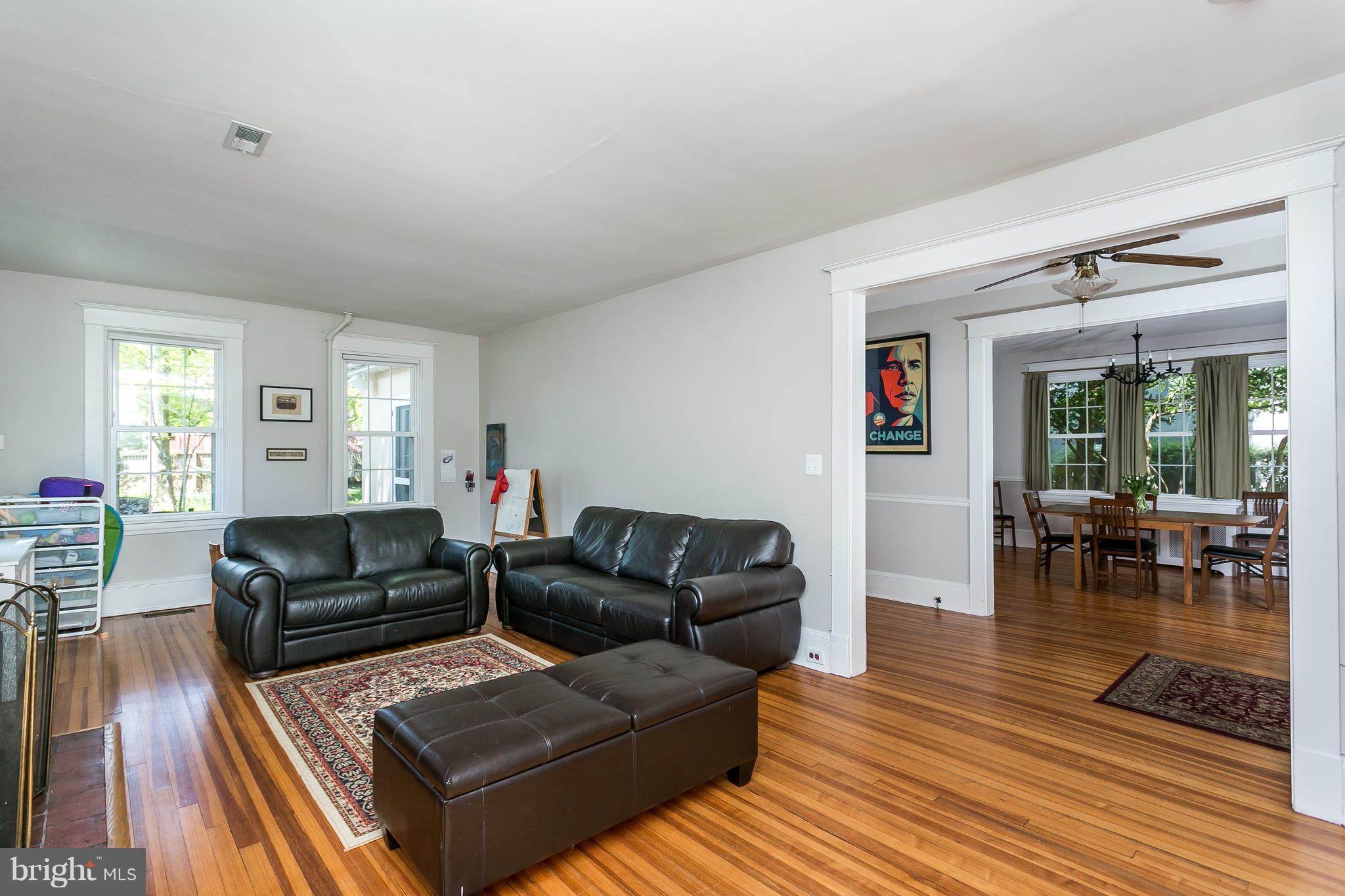 6204 Pinehurst Road Baltimore, MD 21212 - Photo 5 of 29 a living room with furniture and a wooden floor