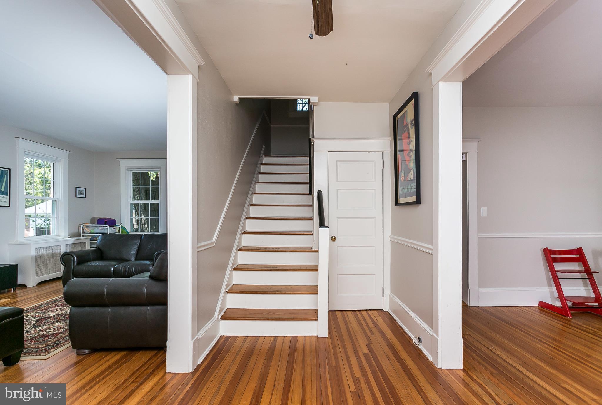 6204 Pinehurst Road Baltimore, MD 21212 - Photo 6 of 29 a view of entryway with wooden floor and stairs
