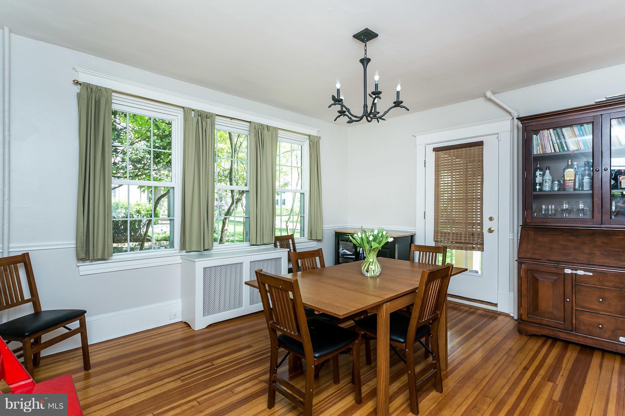 6204 Pinehurst Road Baltimore, MD 21212 - Photo 7 of 29 a view of a dining room with furniture window and wooden floor