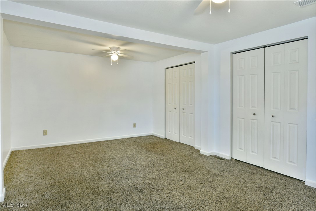 37 Morningside Road Niles, OH 44446 - Photo 32 of 39 Unfurnished bedroom with carpet floors, multiple closets, and ceiling fan