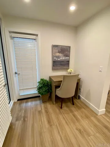 a workspace with furniture and wooden floor