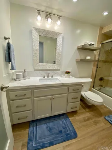 a bathroom with a double vanity sink mirror and