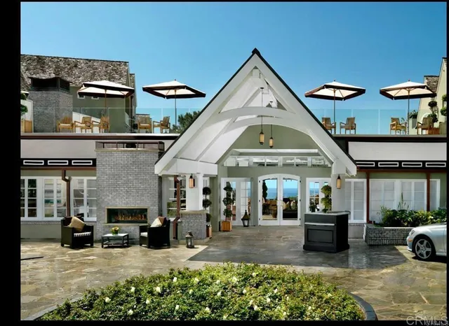 a view of a hall with a dining table and chairs