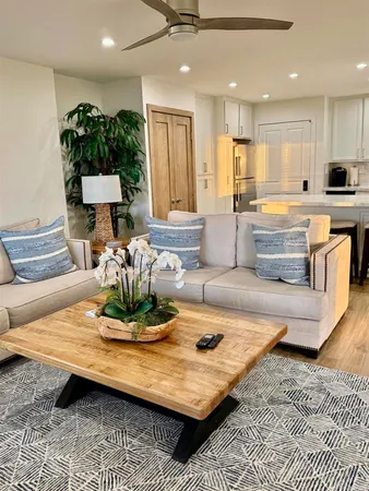 a bathroom with a granite countertop sink a toilet and shower