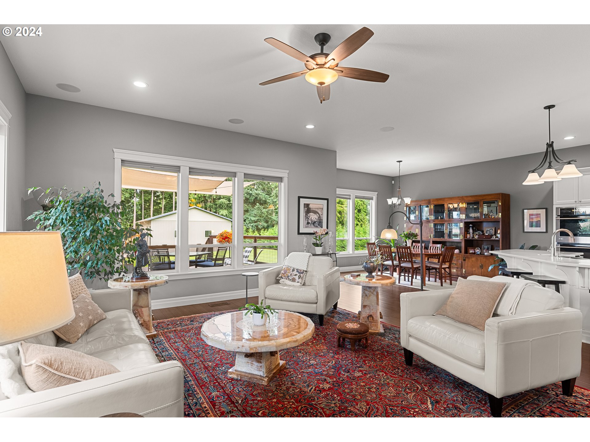 25595 South Rhoten Road Aurora, OR 97002 - Photo 14 of 48 a living room with furniture and a large window